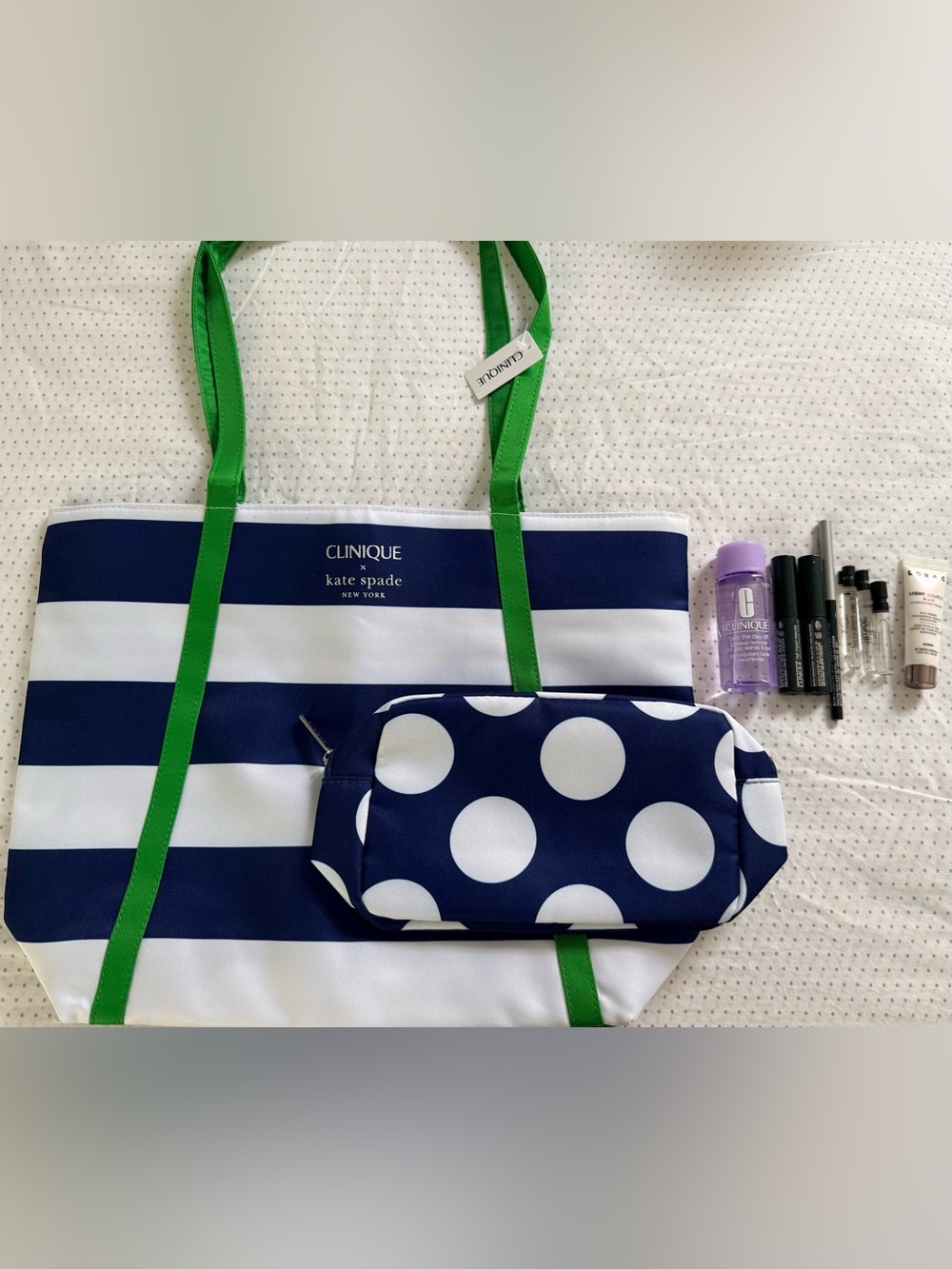 Clinique x Kate Spade 
Reversible water resistant tote and pouch